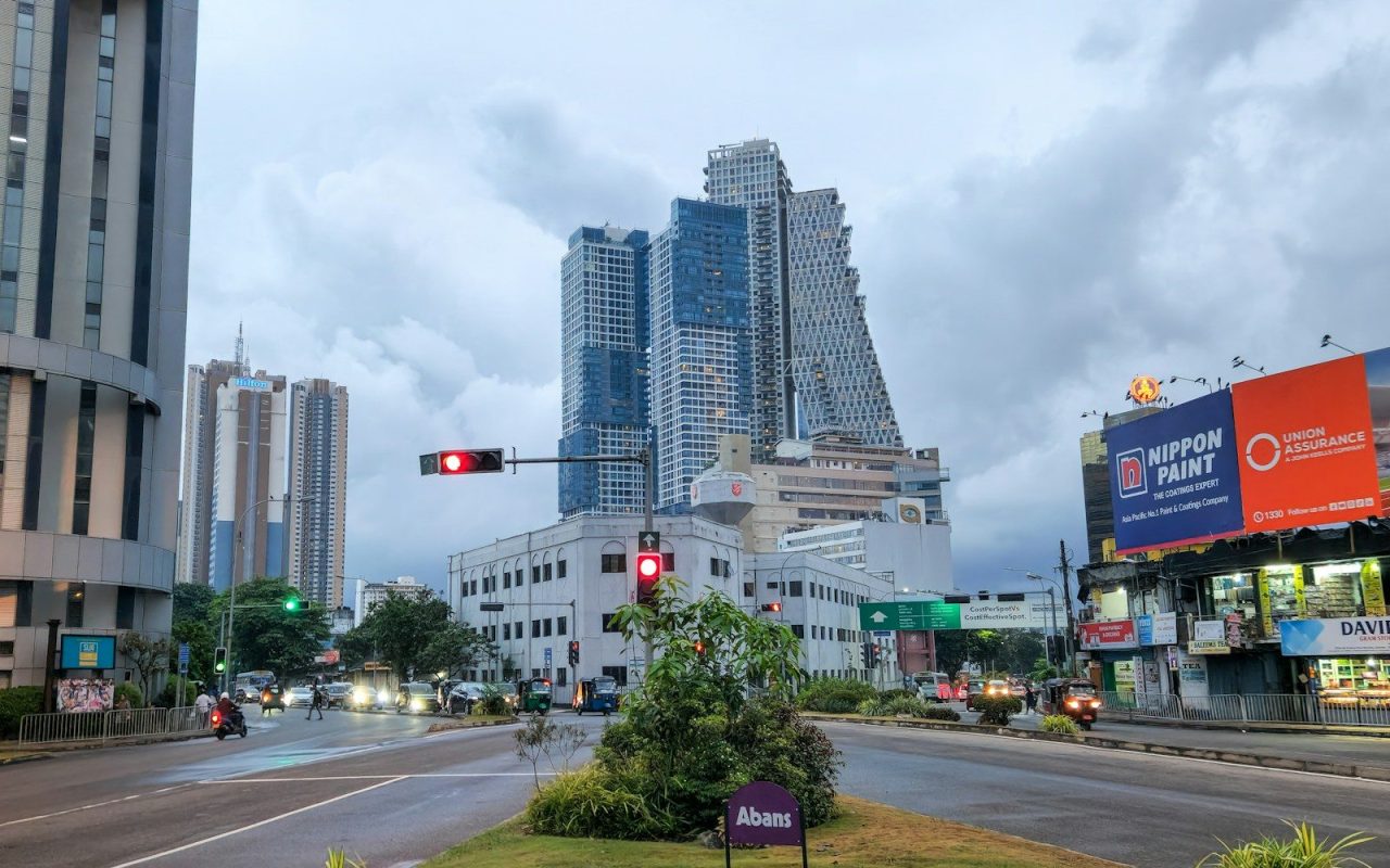 Cityscape view with buildings and overcast sky.